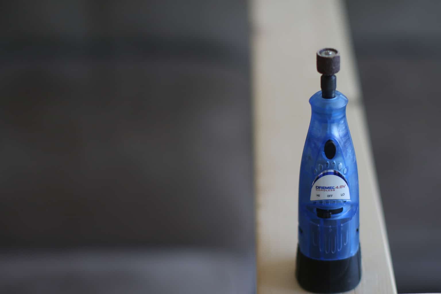A Dremel sits on a table ready to use