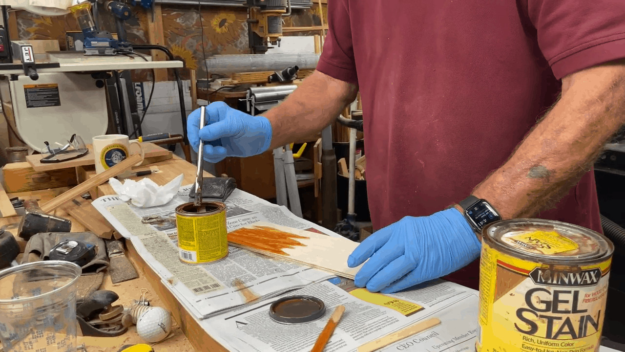 Man comparing Minwax vs Varathane