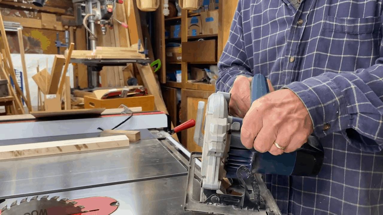 Man holding a circular saw