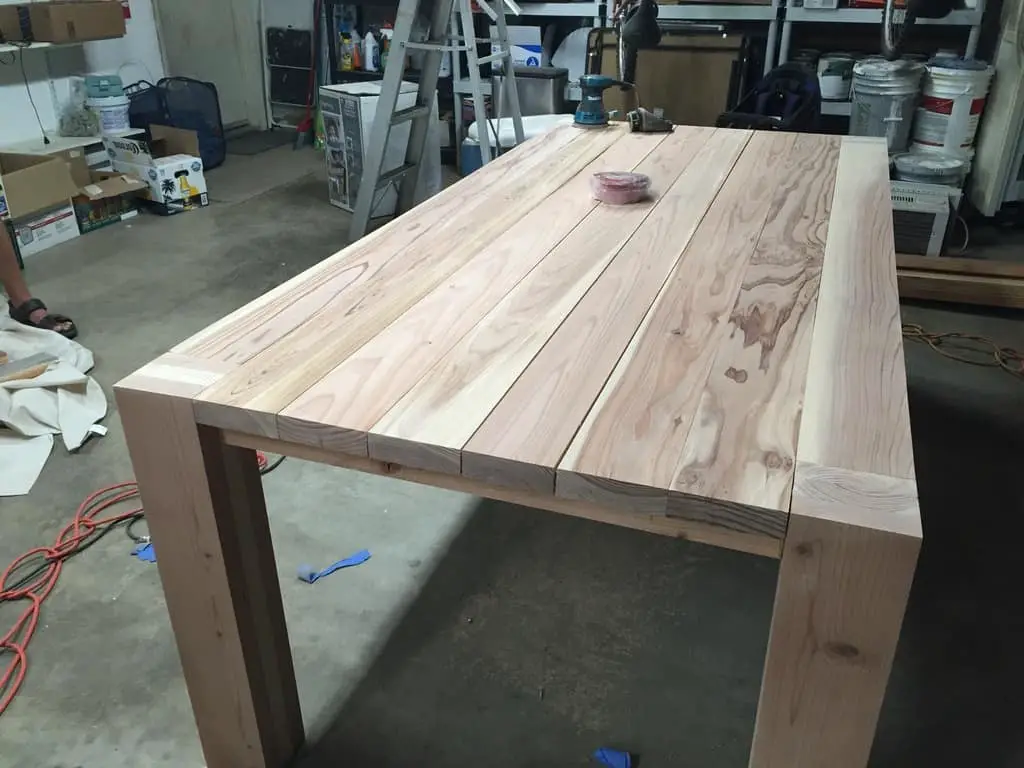 Wooden table about to be applied with a wood finish