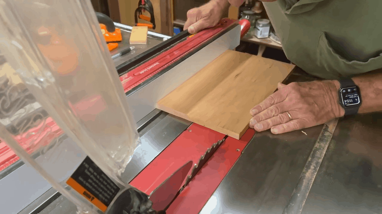 Man demonstrating how to square plywood on a table saw