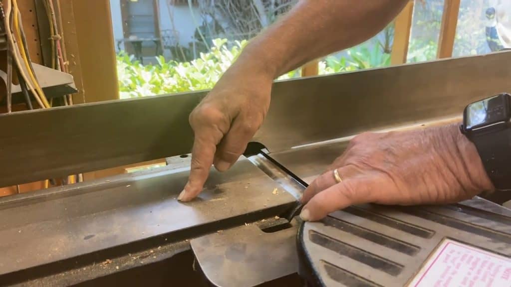 Person pointing the parts of a jointer