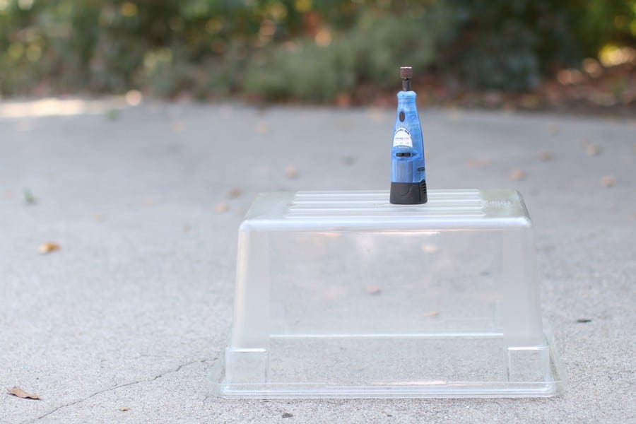 Dremel on top of a plastic container